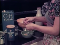 Woman_Bakes_Bread_and_Gives_a_Slice_to_Her_Husband_ca__1950s